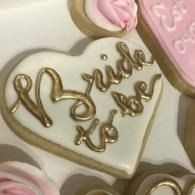 Bride to be cookie with pink icing accents