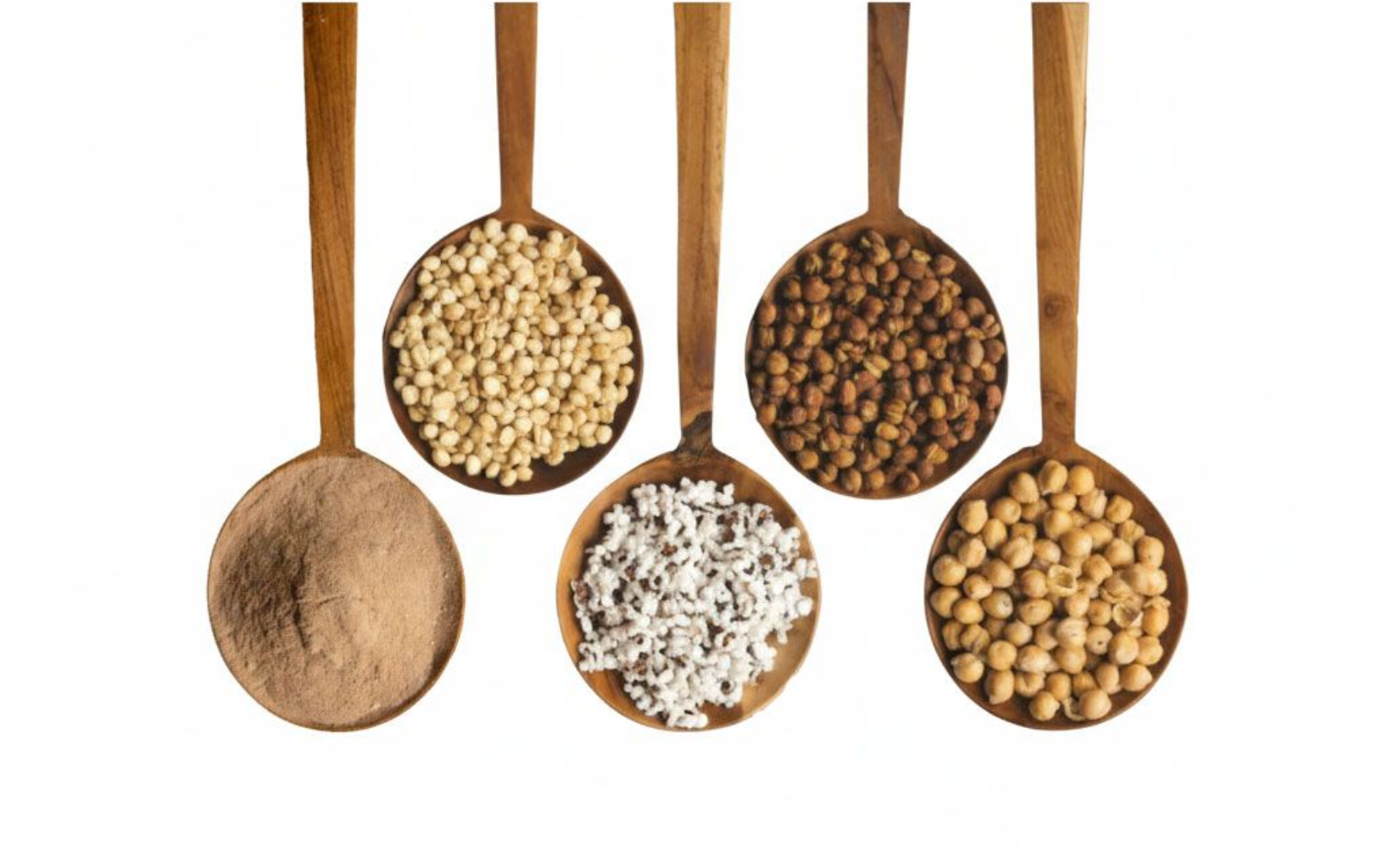 Wooden spoons filled with assorted grains and legumes on a white background