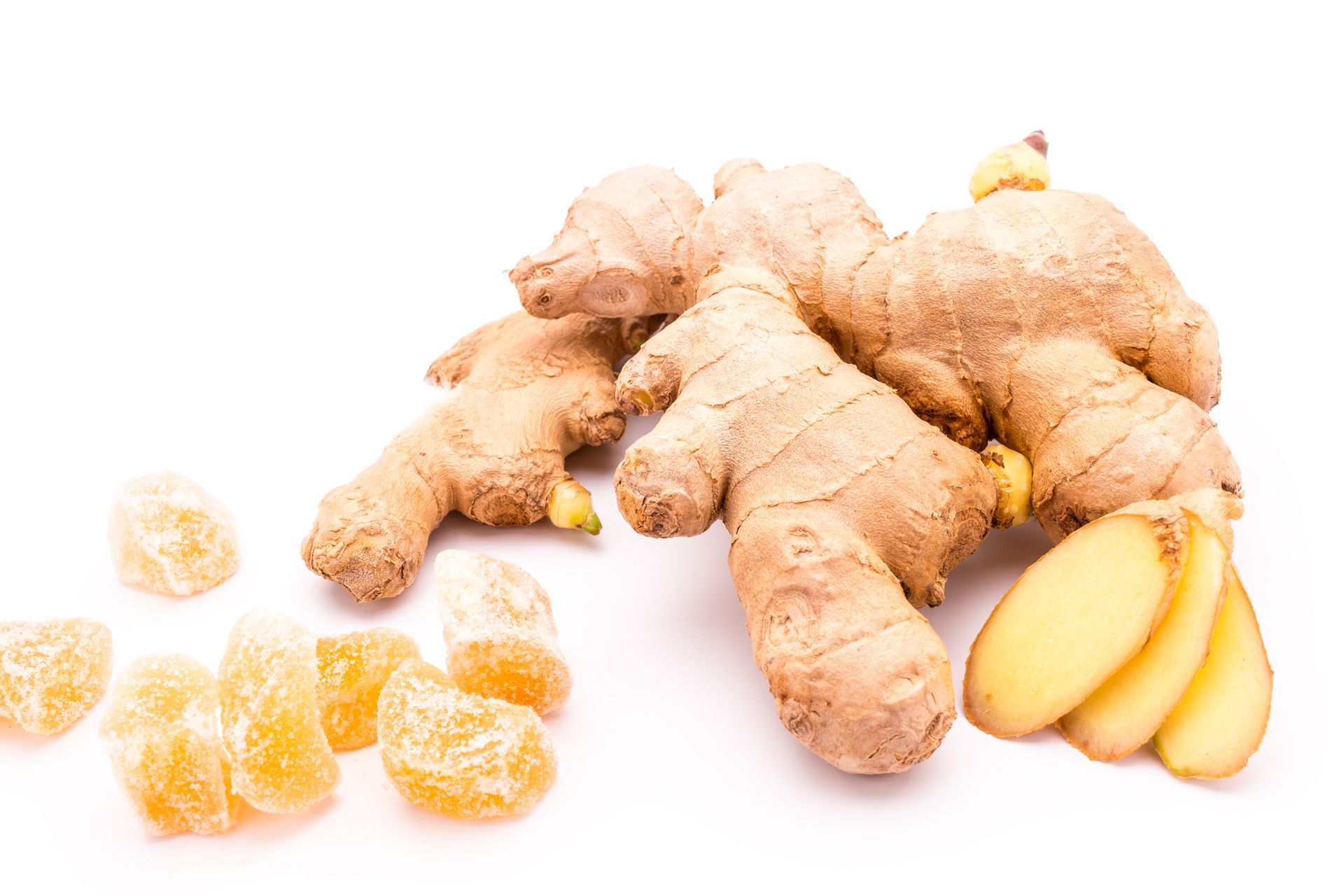 Ginger root, peeled orange segments, and sliced ginger on a white background
