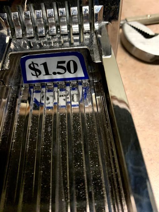 a close up of a machine that says $ 1.50 on it