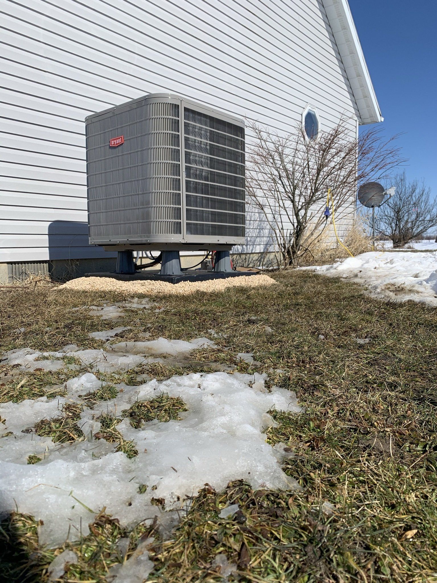 Gray Heat Pump Outside the Beautiful House — Spencerville, OH — Matt’s Heating & Cooling LLC