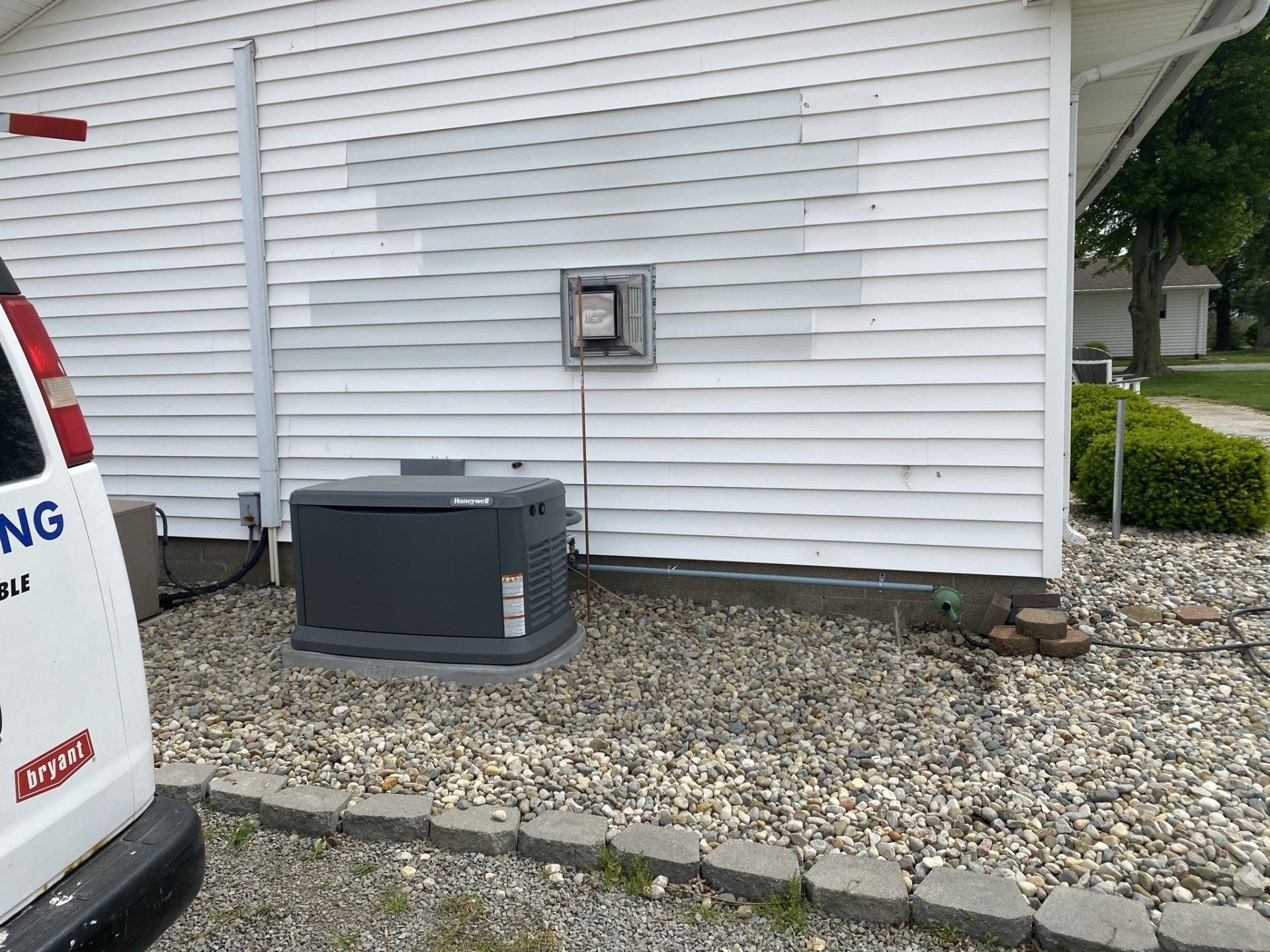 Gray Inverter Installed Outside the House — Spencerville, OH — Matt’s Heating & Cooling LLC