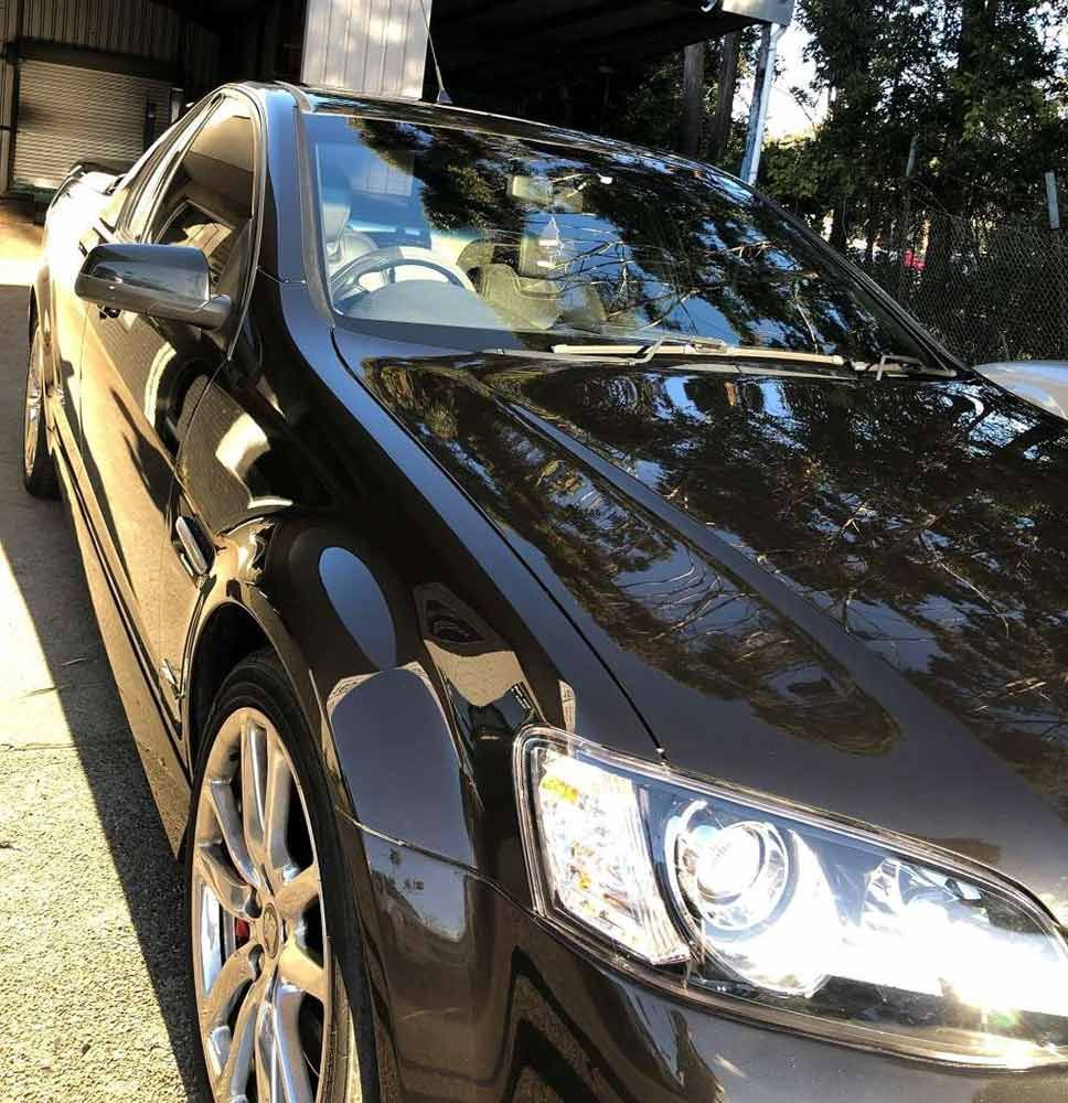 A Black Car is Parked in Front of a Building — Endrust (Coffs Harbour) in Coffs Harbour, NSW