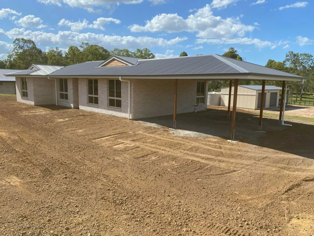 A Single-Story House with A Carport Under Construction — Country to Coast Homes In Gregory River, QLD