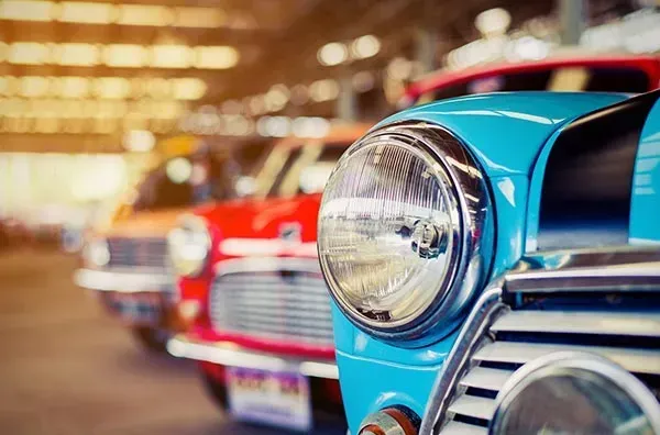 A Row of Old Cars Are Parked in A Garage — Wyong Radiator Repairs in Tuggerah, NSW