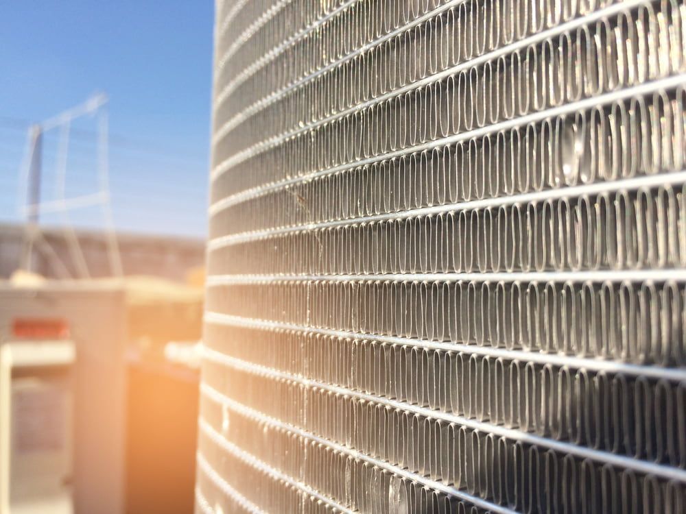 A Close up Of a Radiator on A Building with A Blue Sky in The Background — Wyong Radiator Repairs in Tuggerah, NSW