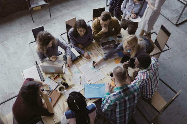 people sitting at boardroom table