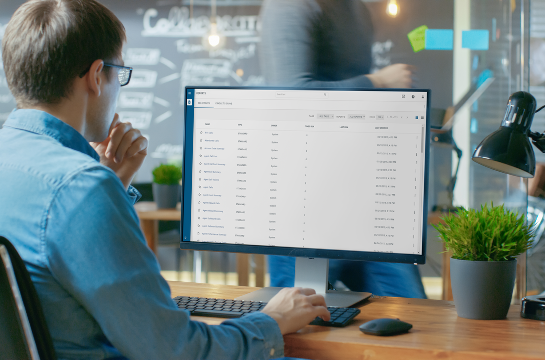 Man sitting at desk working on a computer