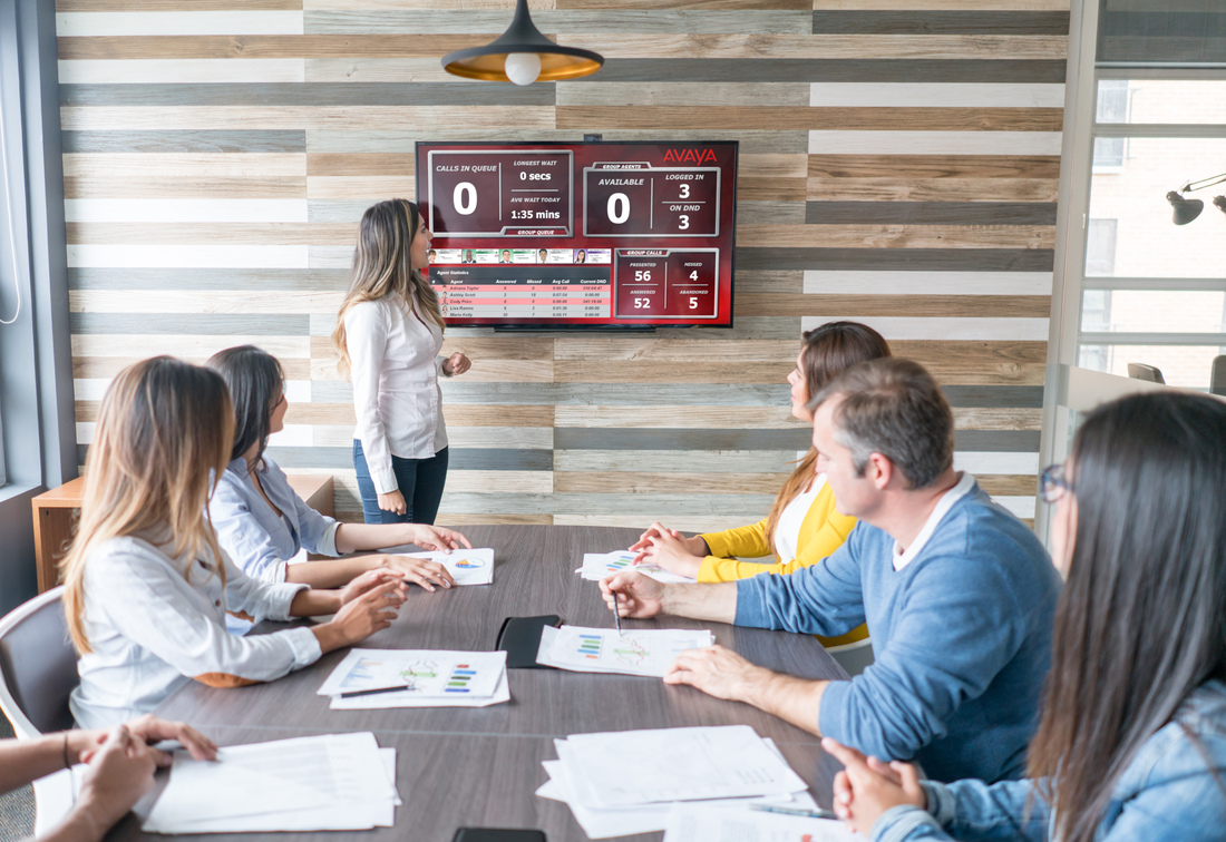 People in meeting looking at presentation