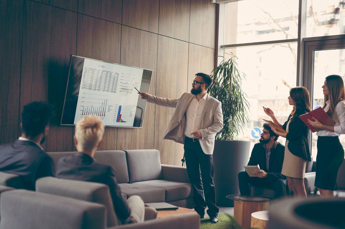 Man doing a presentation for work collegues