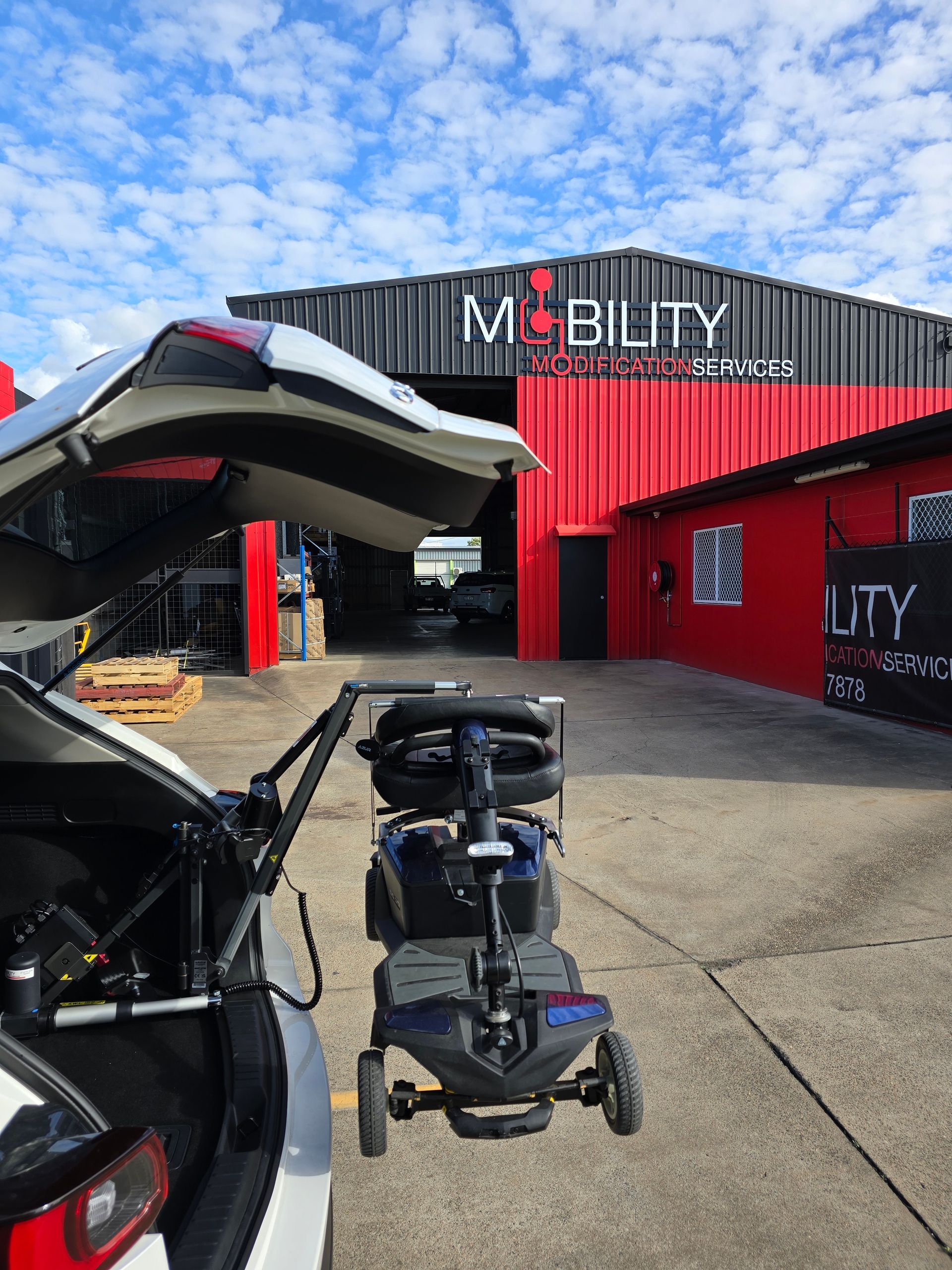 A Turny Seat At The Back Of A Car — Mobility Modification Services In Garbutt, QLD