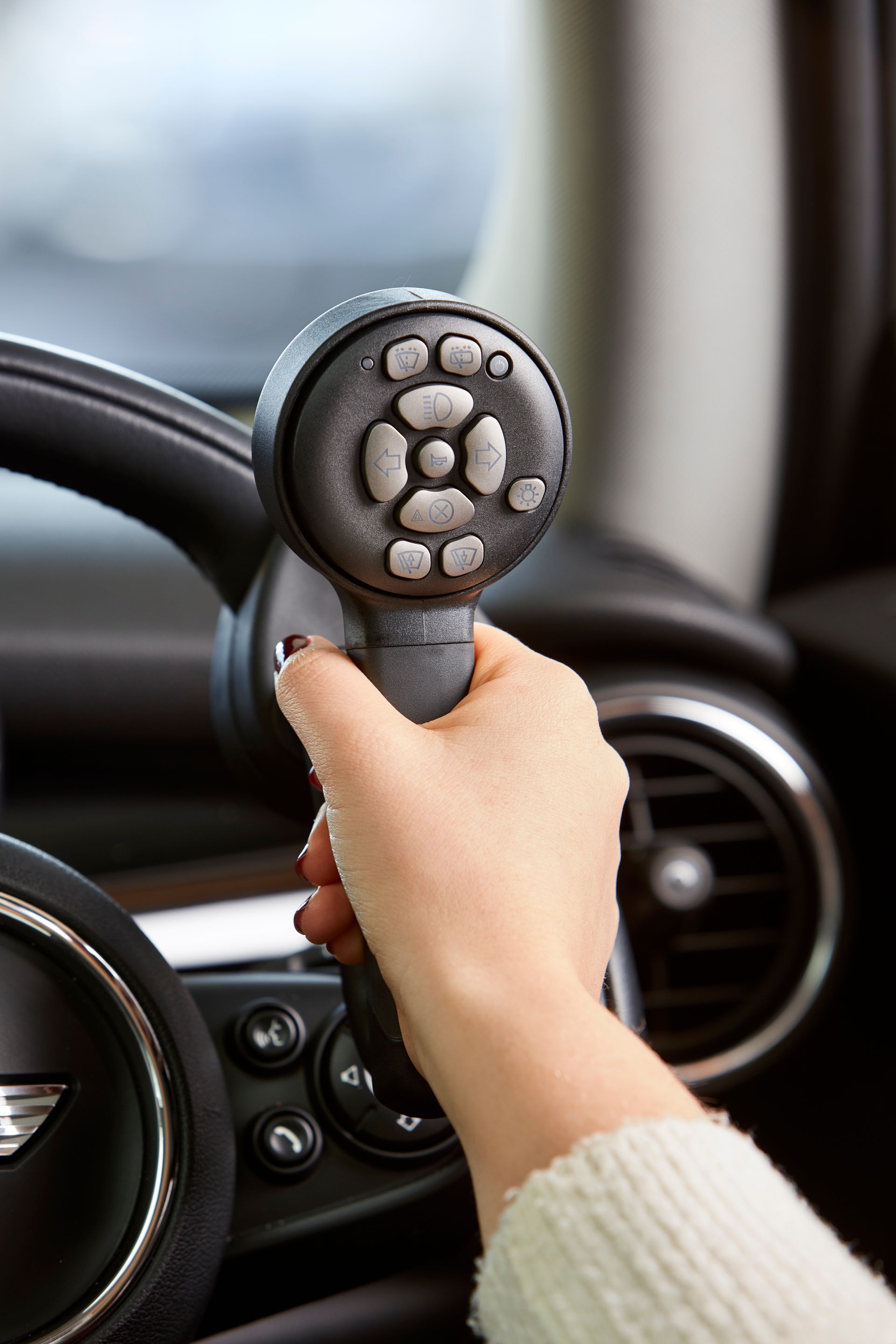 A Close up Of a Grip Spinner With Buttons On The Steering Wheel — Mobility Modification Services In Garbutt, QLD