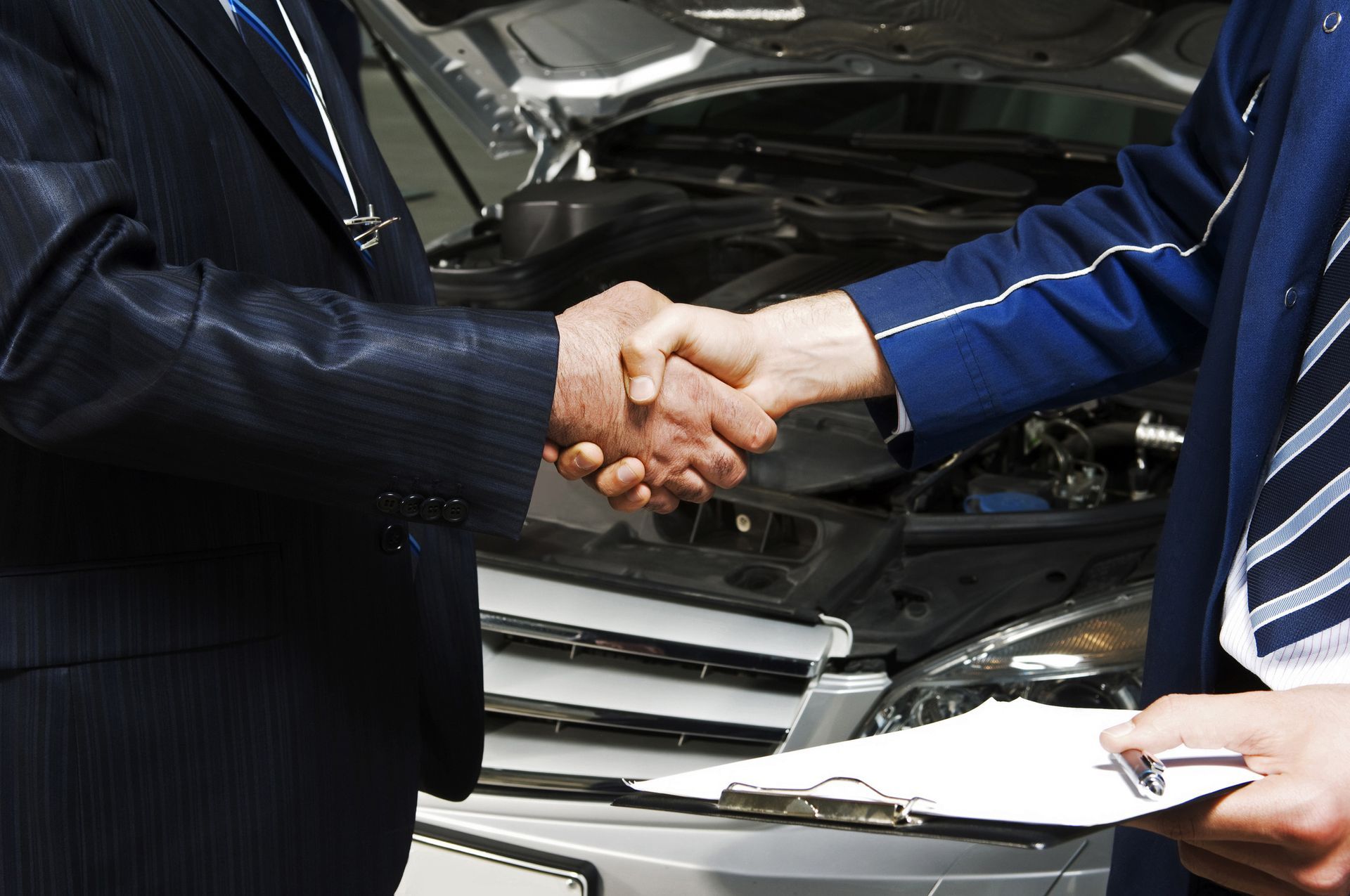 Men Shaking Their Hands — Des Plaines, IL — Schimka Auto Wreckers Inc