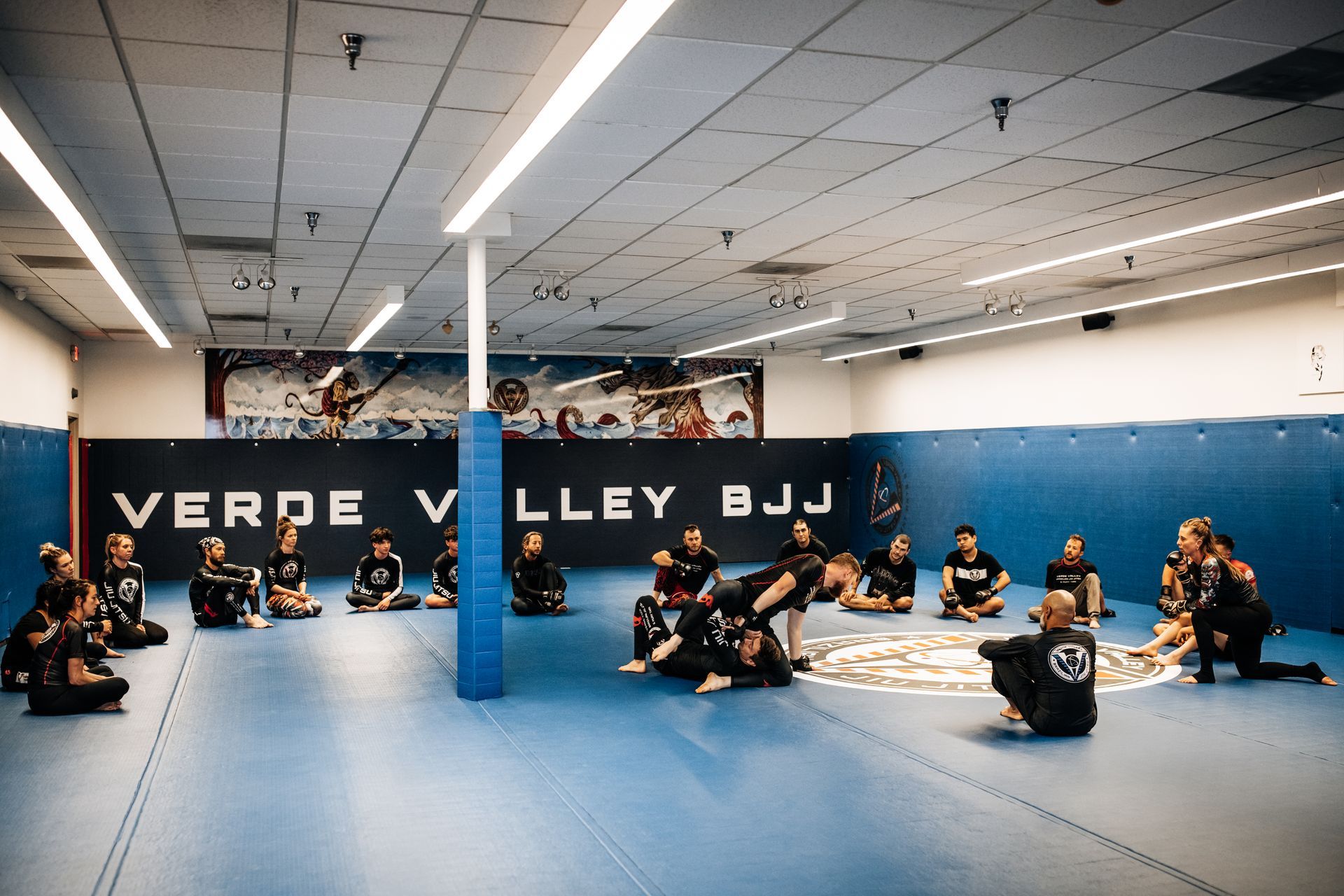 Adults practicing Brazilian Jiu Jitsu drills at Verde Valley Brazilian Jiu Jitsu and Muay Thai in Cottonwood, AZ for fitness