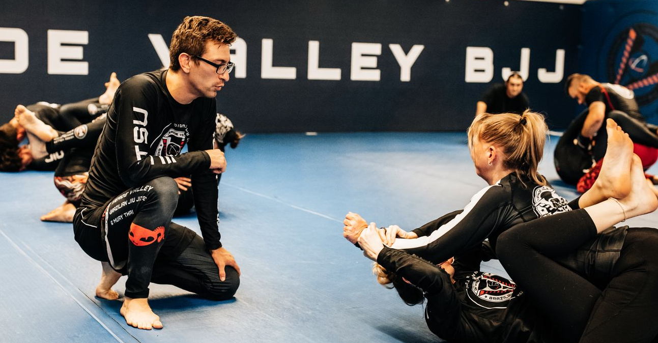 Adults practice BJJ and Muay Thai drills at Verde Valley Brazilian Jiu Jitsu and Muay Thai.