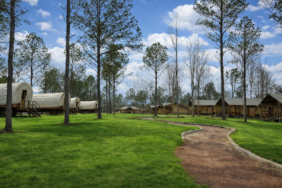 Overall view of Clay Cosmos glamping resort — canvas cabins and Conestoga wagons near Providence Canyon, Georgia