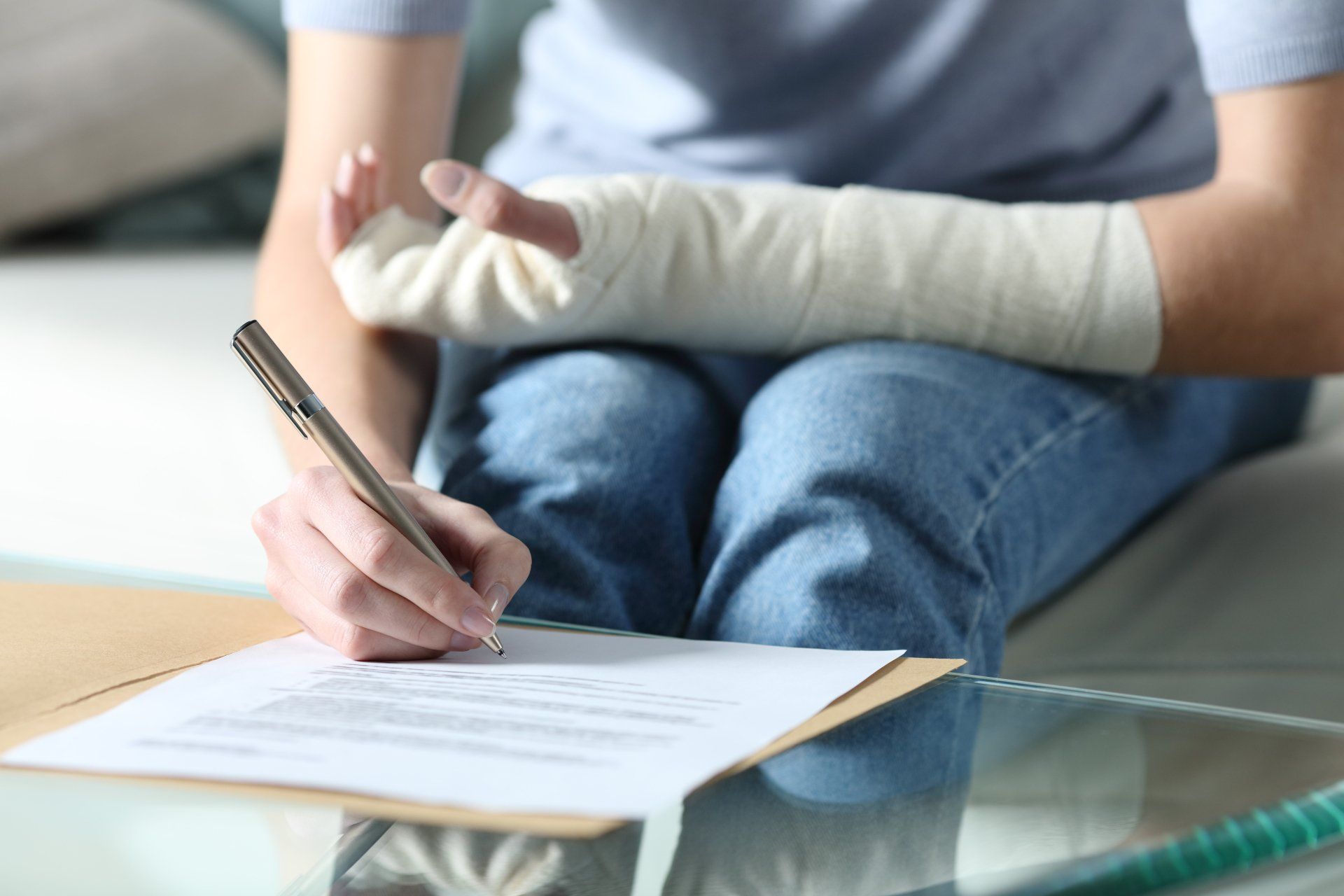 Woman Signing with Injured Hand — Johnson City, TN — Erin McArdle Law