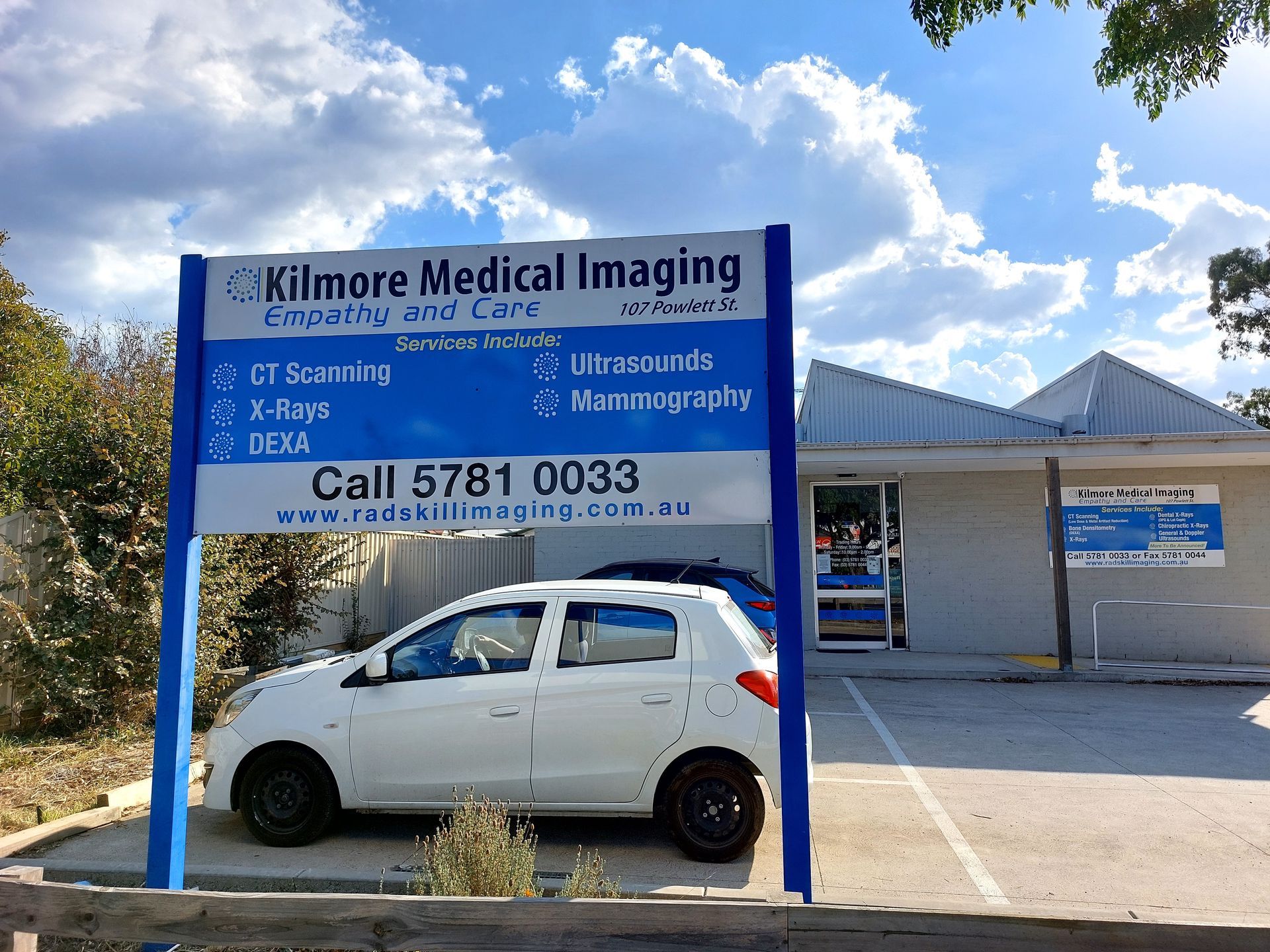 Kilmore Medical Imaging sign in front of the building with a white car parked nearby.