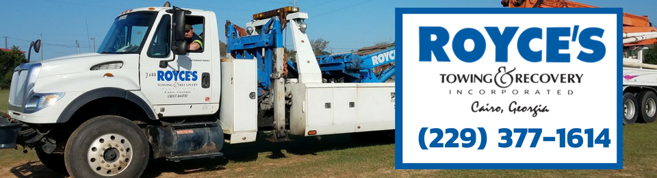 White tow truck with Royce's Towing & Recovery logo and contact info: (229) 377-1614.