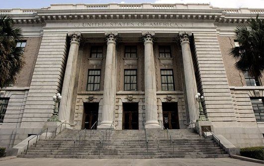 Classical building, United States of America sign above entrance with columns and steps.