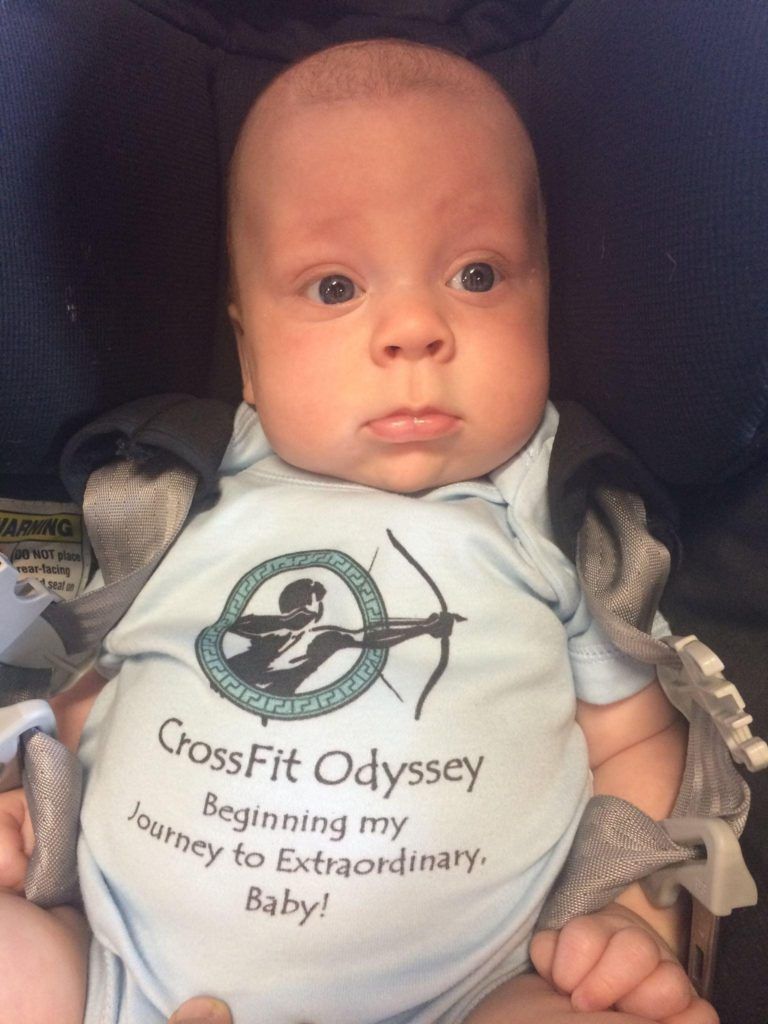 A baby wearing a shirt that says crossfit odyssey