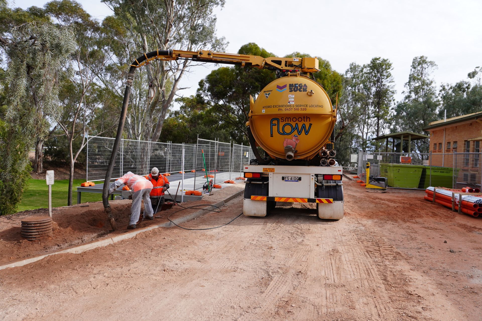 Hydro excavation exposing underground utilities on a civil site