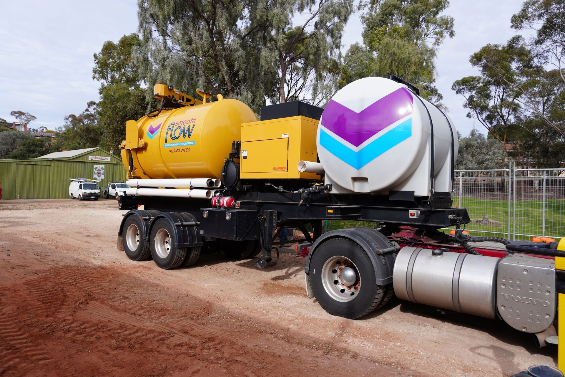 Large vacuum excavation truck with debris tank on a civil construction site
