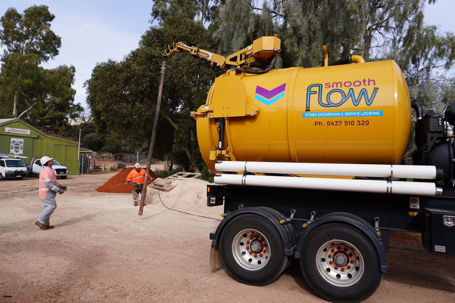 Hydro vacuum excavation truck removing soil and slurry on a civil site