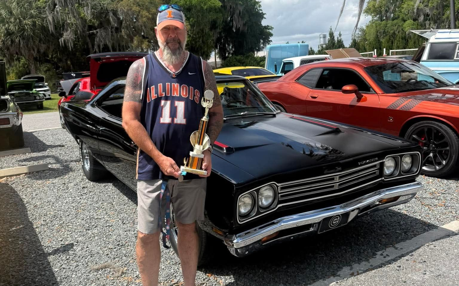Car owner with trophy and prized Plymouth with Liquid PPF for Restomods in Pinellas County