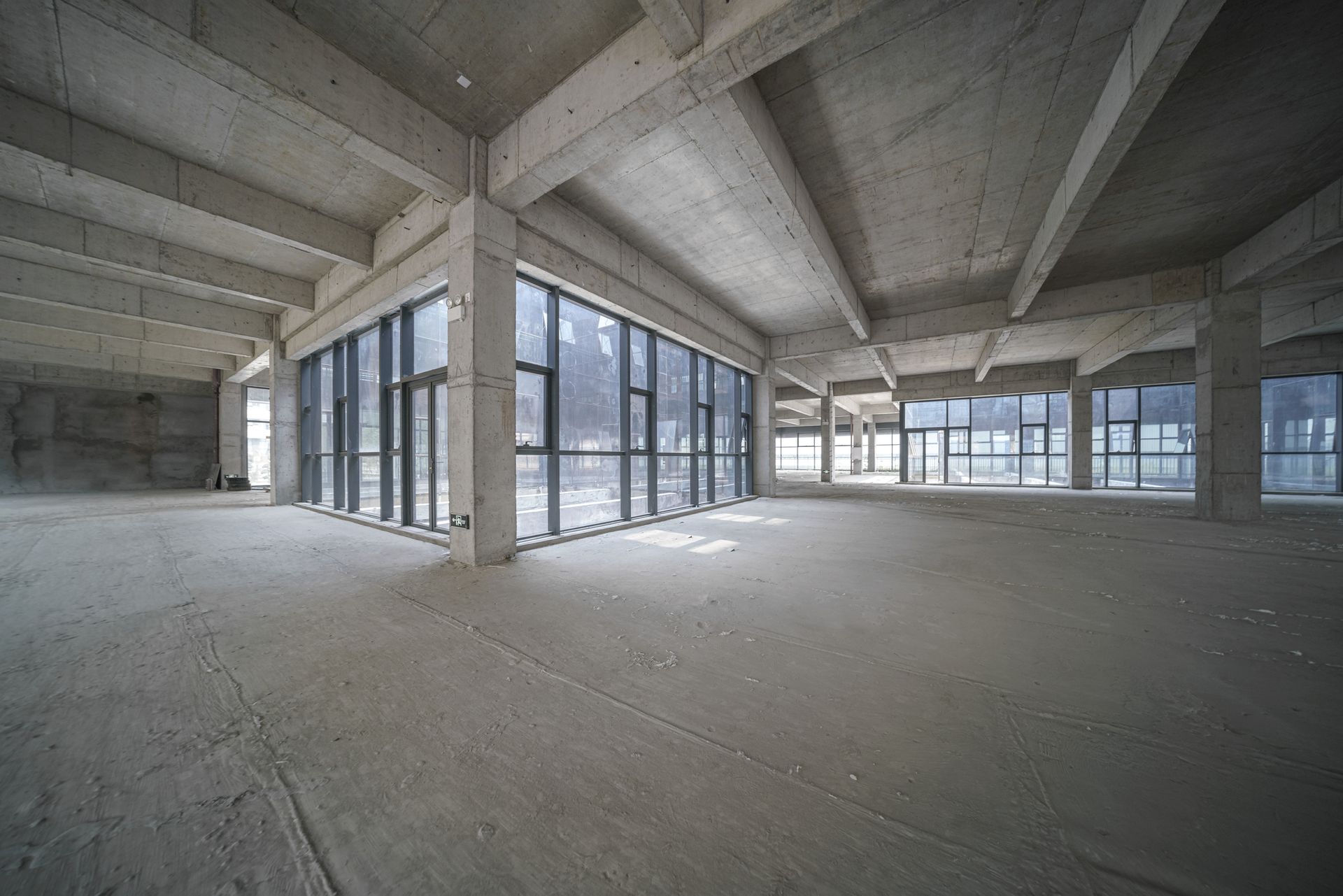 A house with a concrete patio in front of it