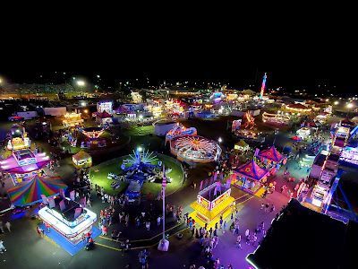 An aerial view of a carnival at night.