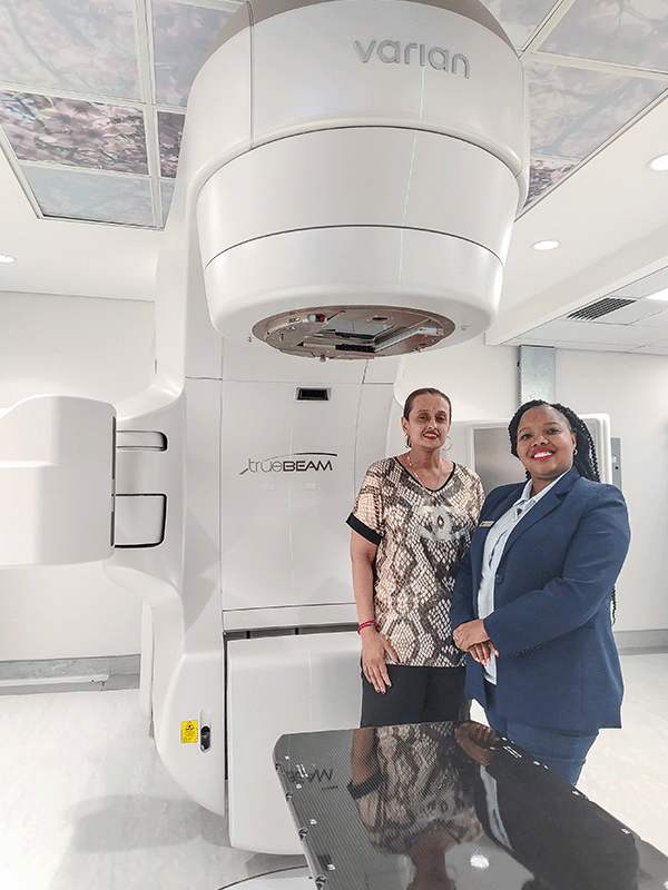 Clinical oncologist Dr Karen Motilall and Netcare Alberton Hospital radiation therapy unit manager Busi Mzelem are pictured with the sophisticated new radiation therapy system which enables targeted external radiotherapy treatment for a wide spectrum of cancers.