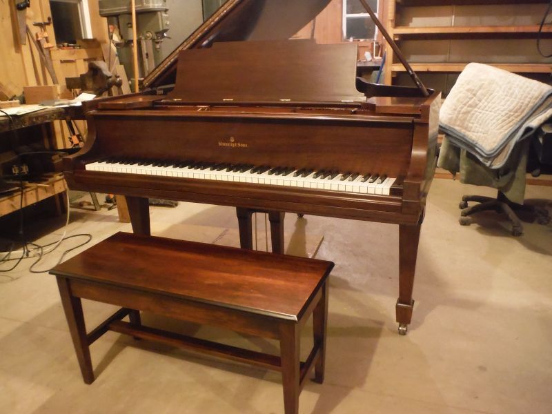 A Grand Piano With a Bench Underneath It — Oro Valley, Arizona — Dfusco Piano LLC