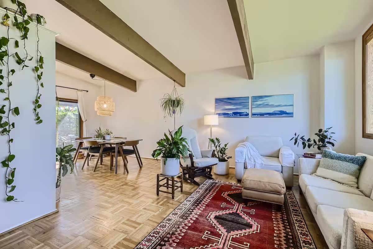 bright living room with wooden beams
