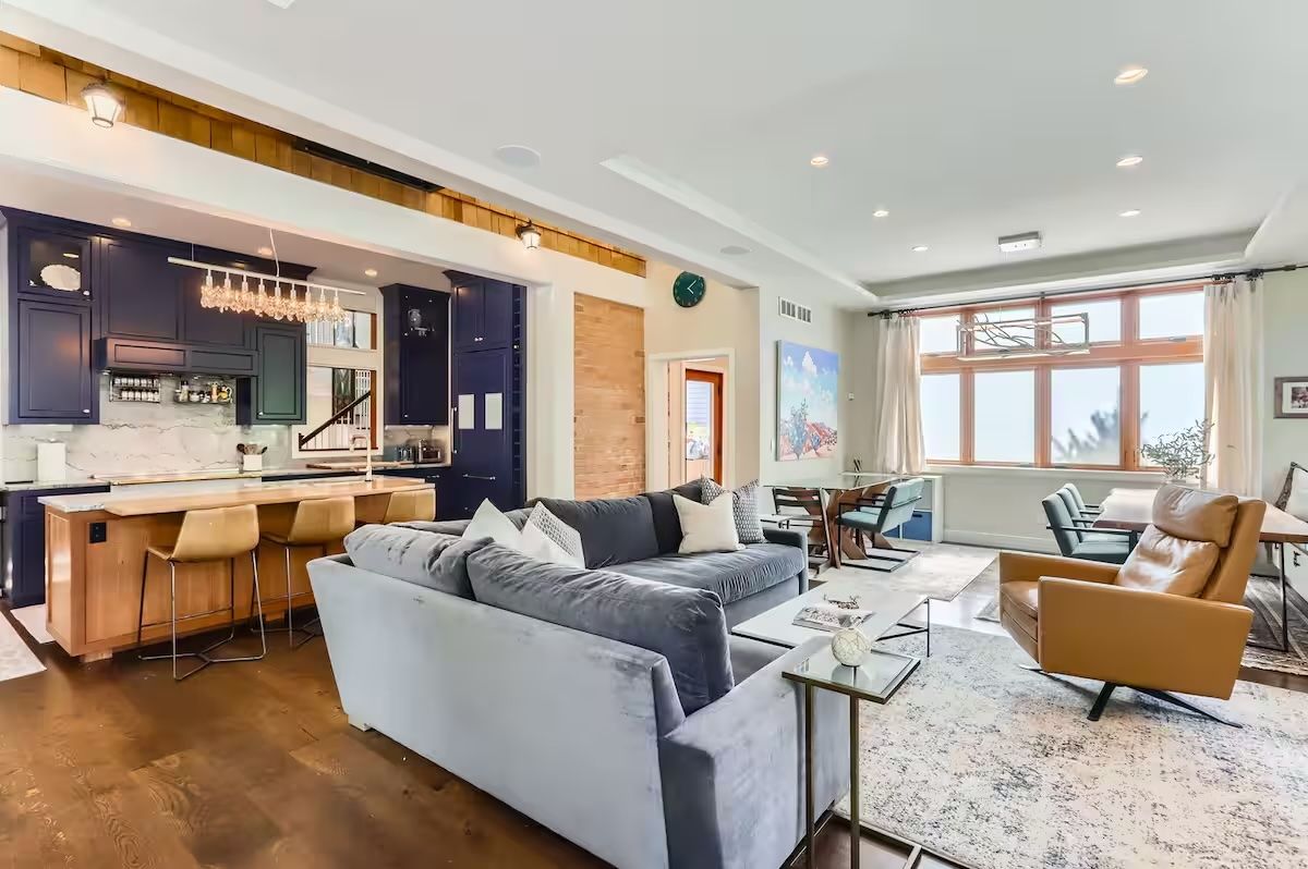 blue kitchen and white living room