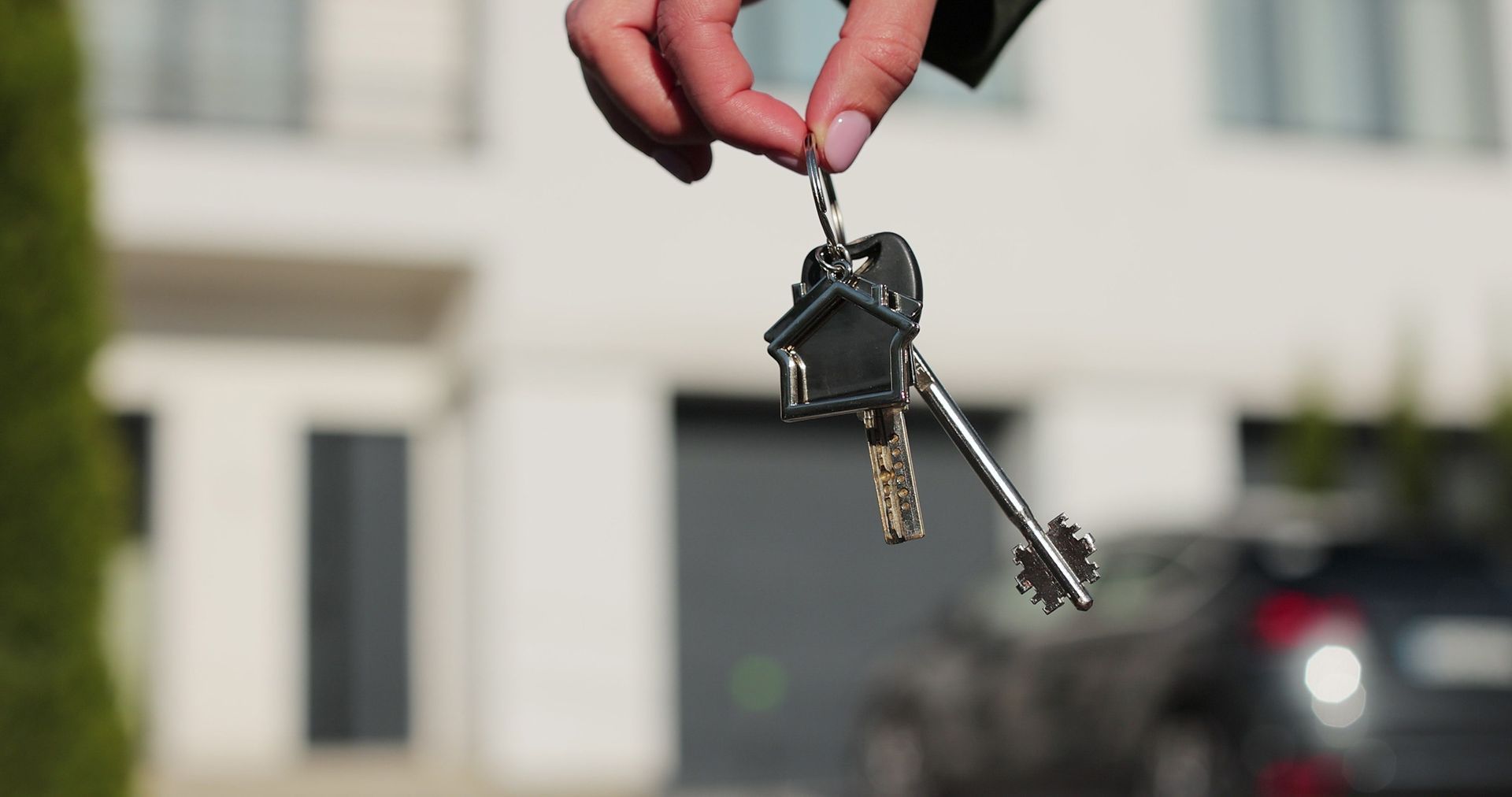 Home owner holding keys to rental