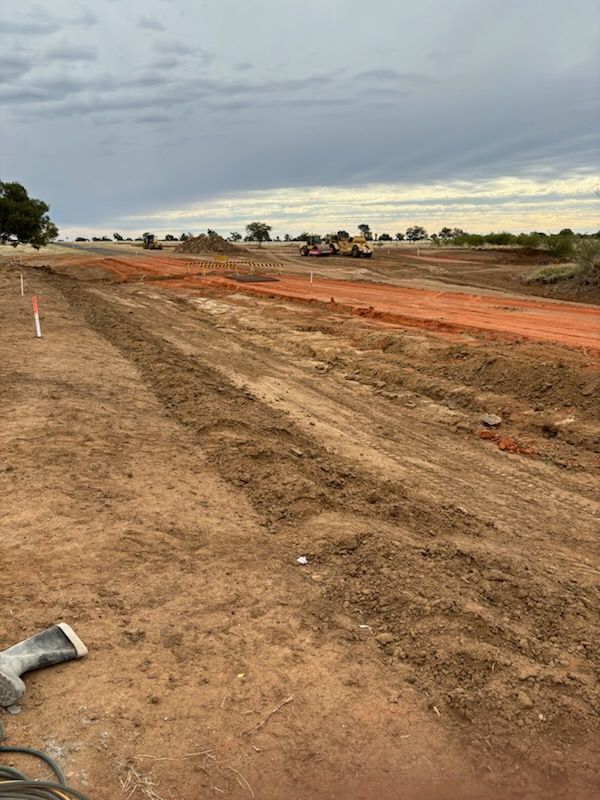 A Dirt Road Is Being Built In The Middle Of A Field — NQES Industries in Ryan, QLD