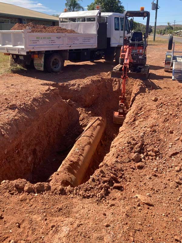 Small Excavator Digging the Water Pipe — NQES Industries in Ryan, QLD