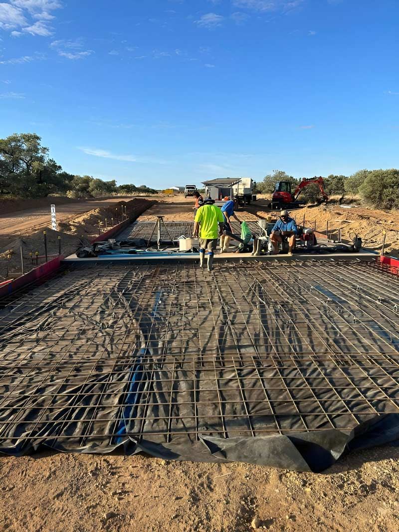 A couple of construction Men Working On The Under Construction Dirt Road — NQES Industries in Blackall-Tambo, QLD