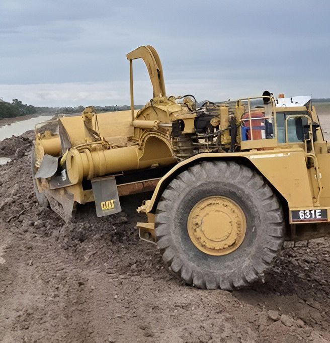 Yellow 631E CAT Excavator Equipment — NQES Industries in Ryan, QLD