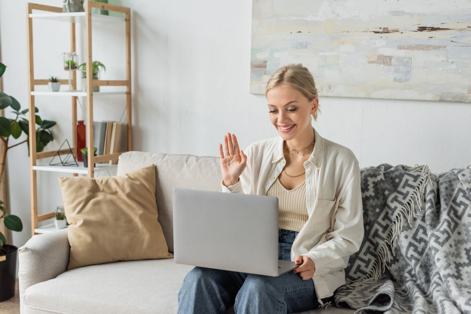 A woman on a video call with her therapist at home, online therapy in Virginia with Lisa Kelleher LP