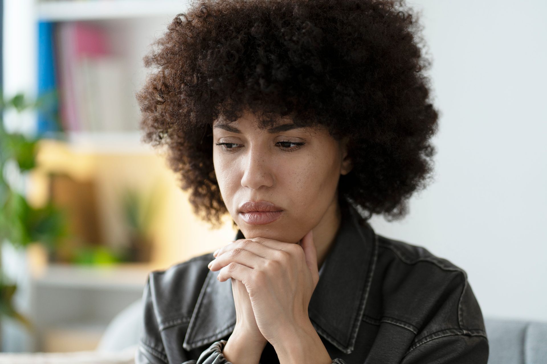 A woman sitting in a therapy office in Northern Virginia, life transitions therapy near me