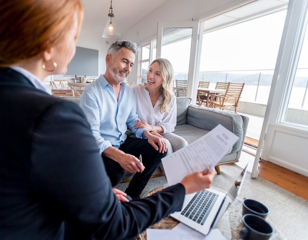 Couple Having A Meeting With Financial Advisor — New York, NY — BlackBelt Wealth Advisory Couple Having A Meeting With Financial Advisor — New York, NY — BlackBelt Wealth Advisory