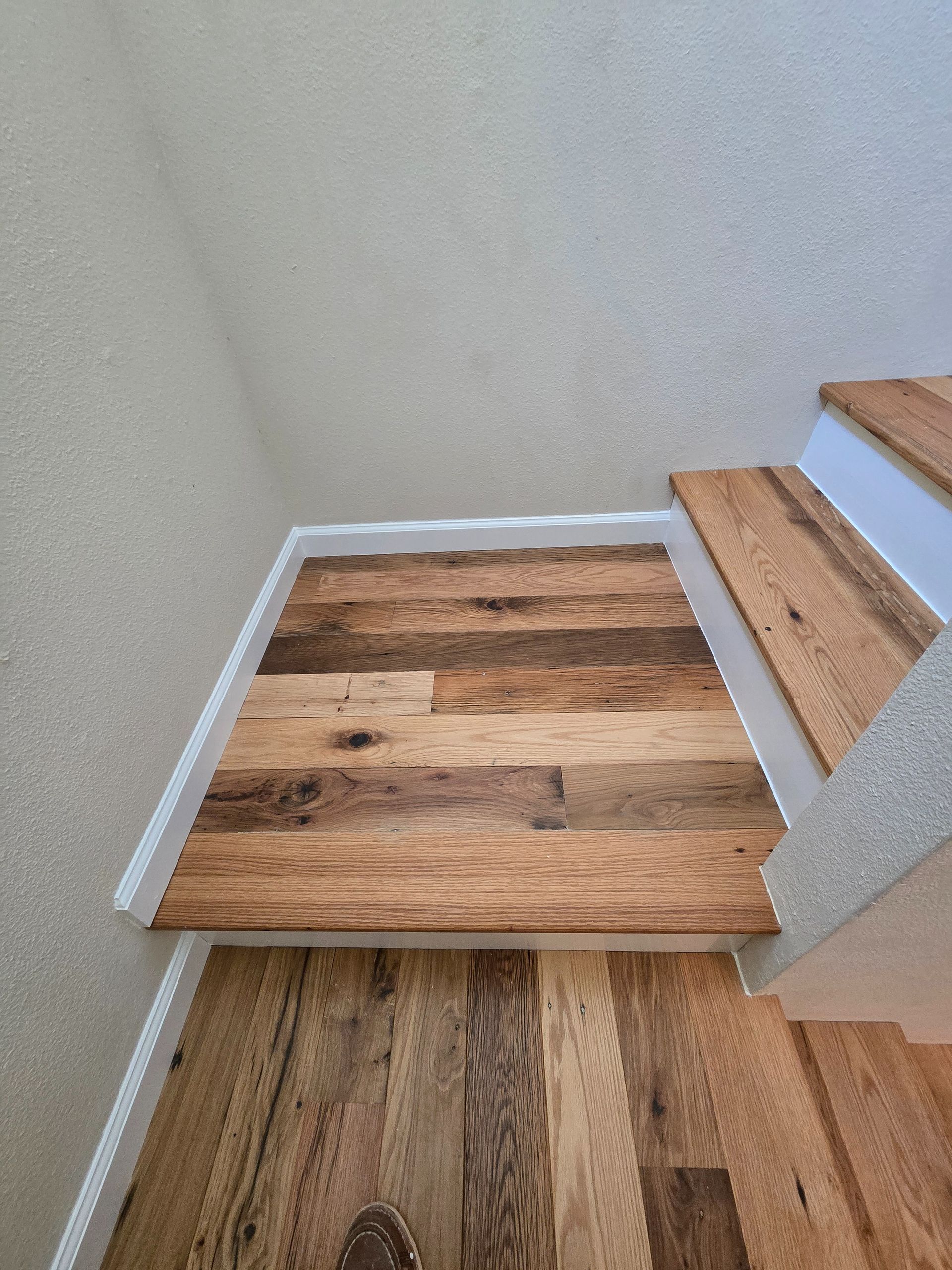 Transformed Davis, CA home by replacing dated Saltillo tile with beautiful, eco-friendly reclaimed hardwood floors.