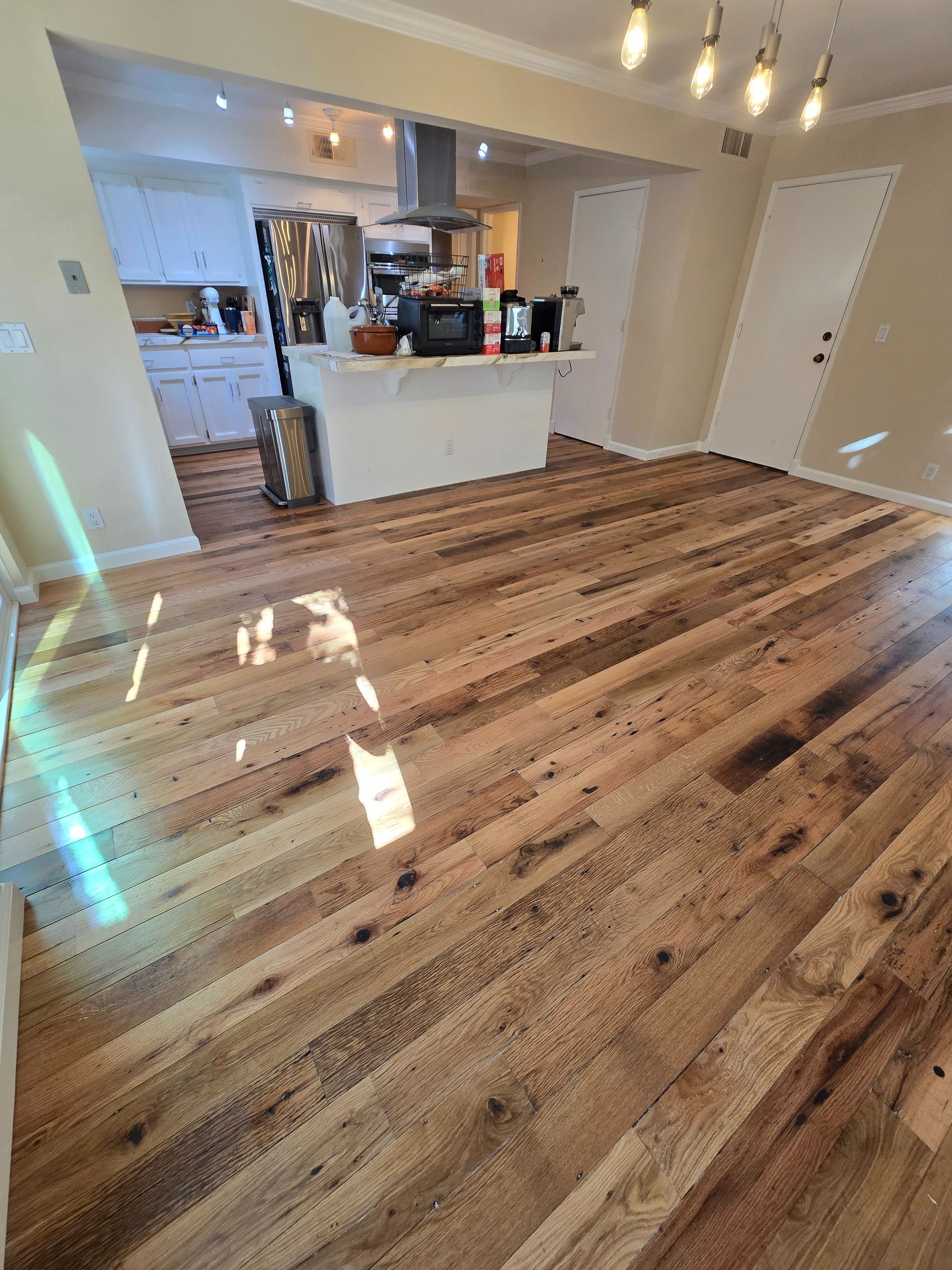 From Saltillo Tile to Reclaimed Hardwood: A Well-Used Floor to a Beautiful Eco-Friendly Floor