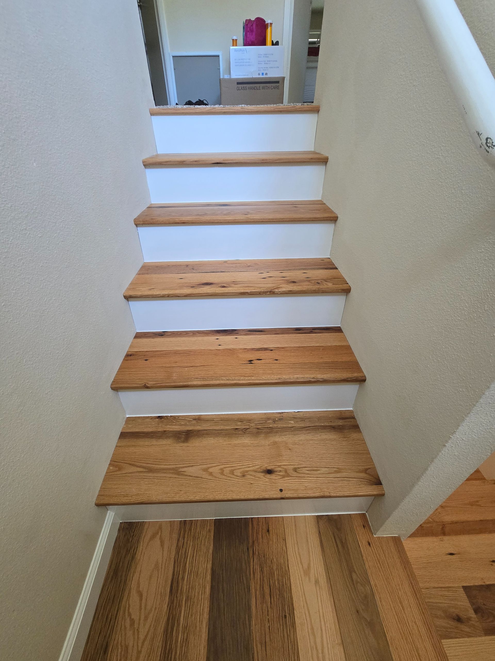 Transformed Davis, CA home by replacing dated Saltillo tile with beautiful, eco-friendly reclaimed hardwood floors.