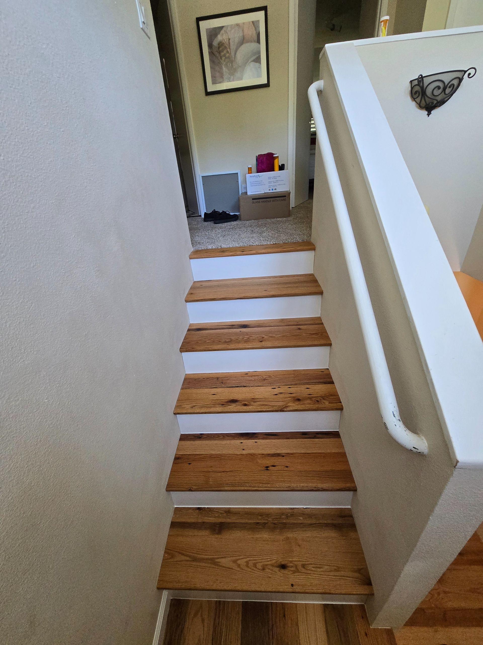 Transformed Davis, CA home by replacing dated Saltillo tile with beautiful, eco-friendly reclaimed hardwood floors.