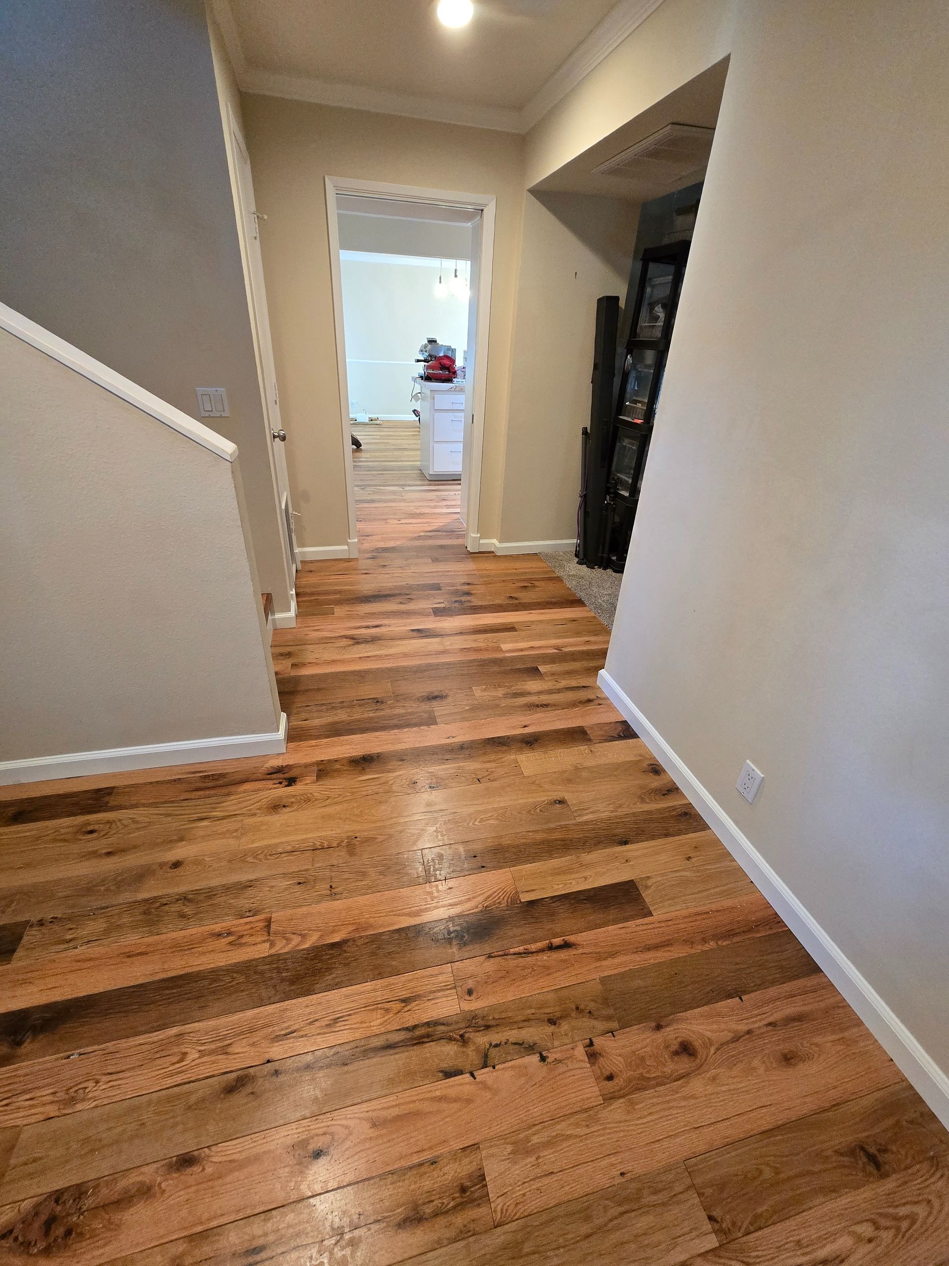 Transformed Davis, CA home by replacing dated Saltillo tile with beautiful, eco-friendly reclaimed hardwood floors.