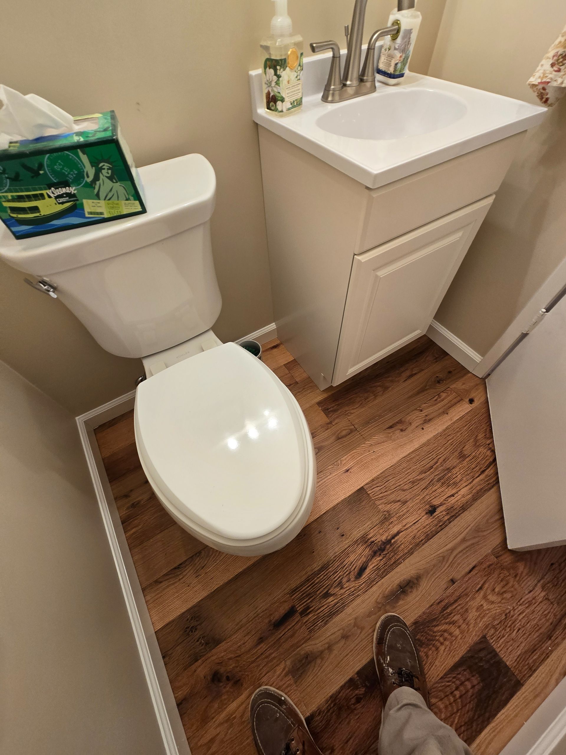 Transformed Davis, CA home by replacing dated Saltillo tile with beautiful, eco-friendly reclaimed hardwood floors.