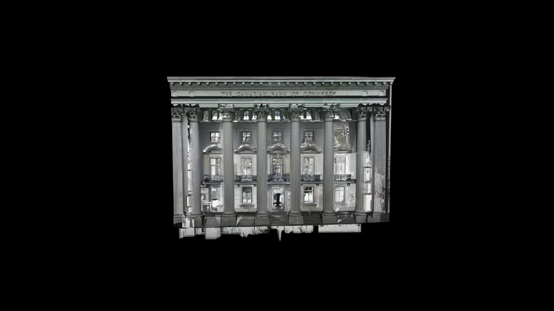 White neoclassical building facade with columns, lit windows, centered on a black background